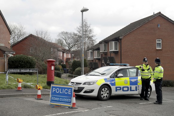 FILE - In this Tuesday, March 13, 2018 file photo, police offices cordon off the road of the residence of former Russian double agent Sergei Skripal in Salisbury, England. Member nations of the global ...