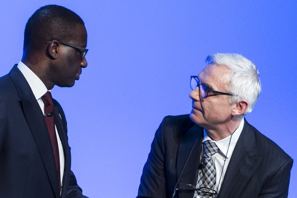 FILE --- Tidjane Thiam, left, CEO Credit Suisse, and Urs Rohner, right, chairman Credit Suisse, after an extraordinary general assembly in Bern, Switzerland, Thursday, November 19, 2015. Credit Suisse ...