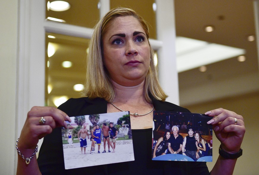 Mavys Alvarez shows photographs of her with Diego Maradona in Havana, Cuba, at the end a press conference in Buenos Aires, Argentina, Monday, Nov. 22, 2021. Alvarez, who as a teenager had a sentimenta ...