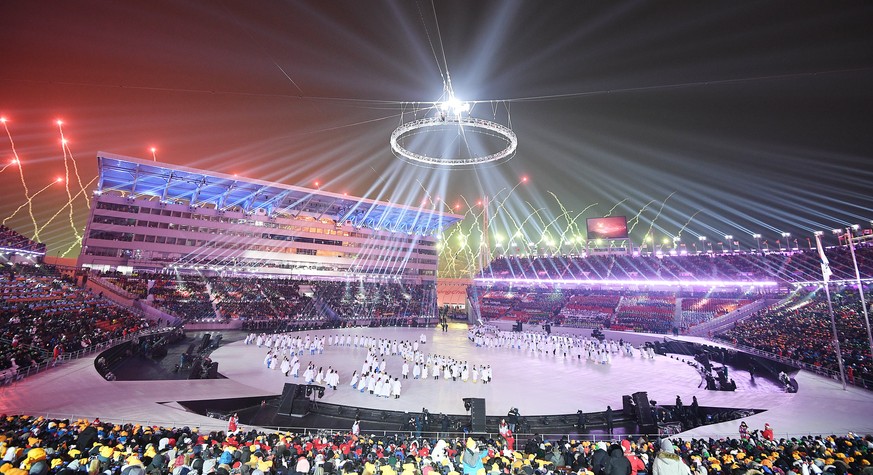 epa06508639 Fireworks light the stadium during the Opening Ceremony of the PyeongChang 2018 Olympic Games at the Olympic Stadium, Pyeongchang county, South Korea, 09 February 2018. EPA/VASSIL DONEV