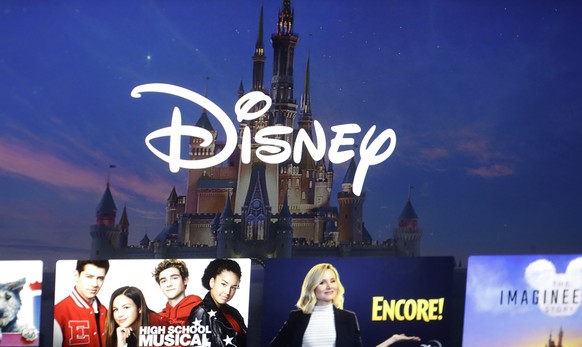 FILE - In this photo taken on Nov. 13, 2019, the Disney logo forms part of the menu of the movie and entertainment streaming service Disney Plus on a computer screen in Walpole, Massachusetts.  Disney announces its profits...