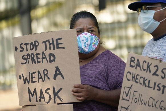 Students and parents gather outside the Governor&#039;s Mansion to urge Gov. Greg Abbott to drop his opposition to public school mask mandates, Monday, Aug. 16, 2021, in Austin, Texas. The Texas Supre ...