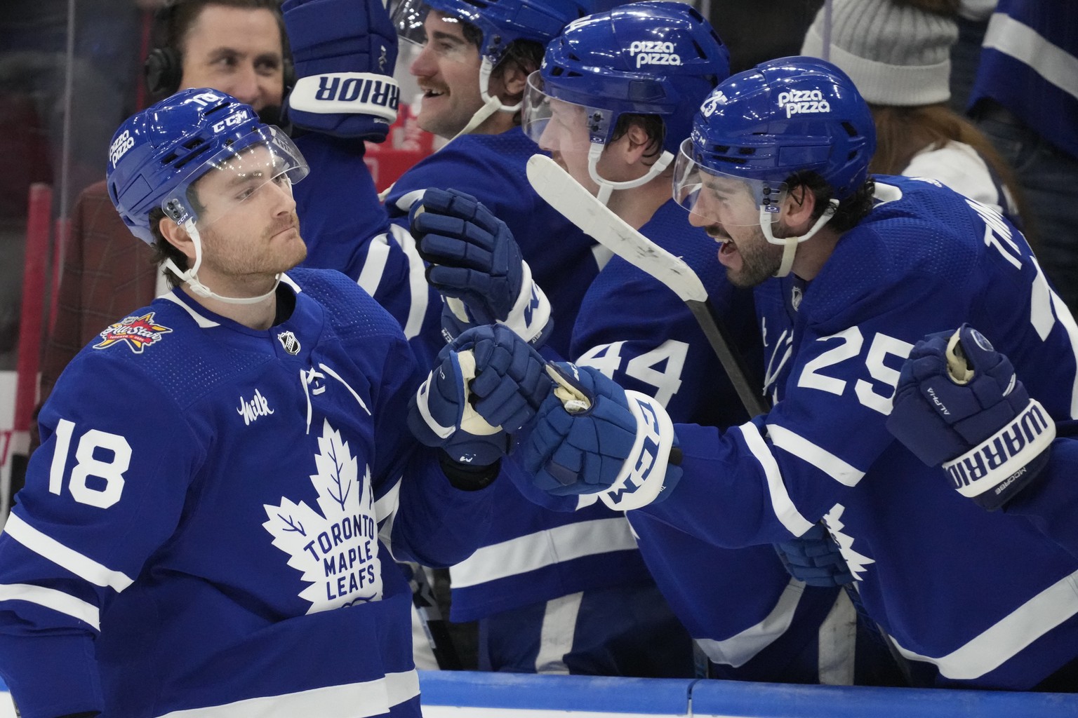 Toronto Maple Leafs center Noah Gregor (18) celebrates with teammates after he scored the game-winning goal against Florida Panthers goaltender Anthony Stolarz during a shootout in an NHL hockey match ...