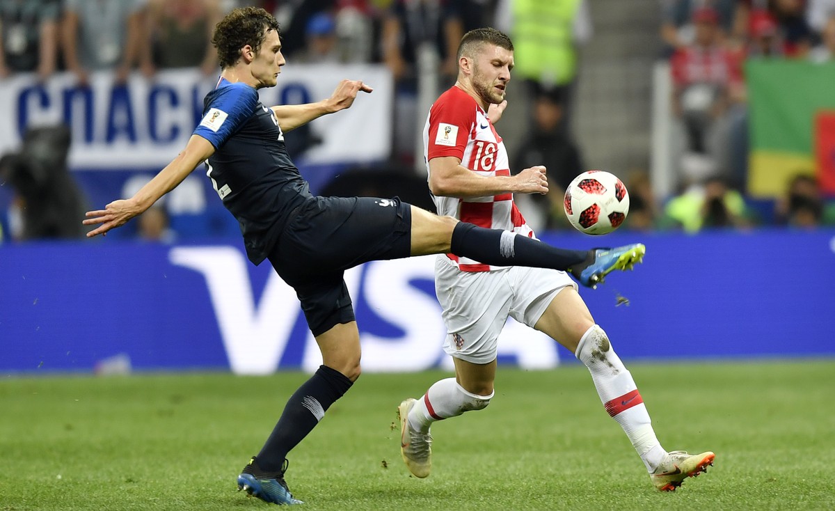 France's Benjamin Pavard, left, and Croatia's Ante Rebic challenge for the ball during the final match between France and Croatia at the 2018 soccer World Cup in the Luzhniki Stadium in Mosc ...
