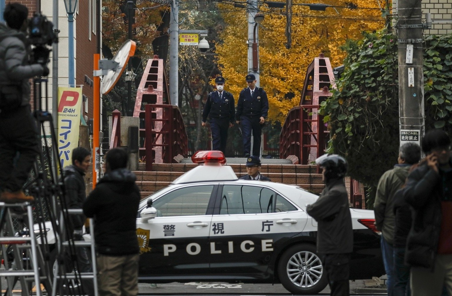 epa06376058 Policemen walk inside the police control line at the Tomioka Hachimangu Shrine in Tokyo, Japan, 08 December 2017. According to media reports, three people were killed and one was seriously ...
