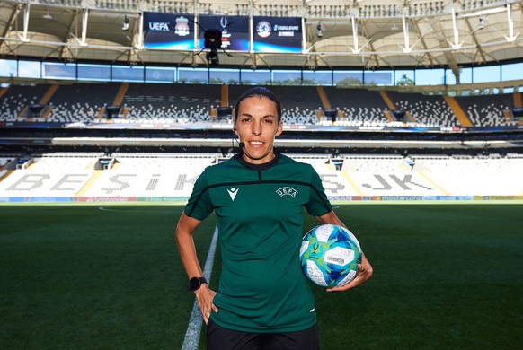 epa07771710 A handout photo made available by the UEFA of main referee Stephanie Frappart of France posing with the official match ball ahead of the UEFA Super Cup Final between Liverpool FC and Chels ...