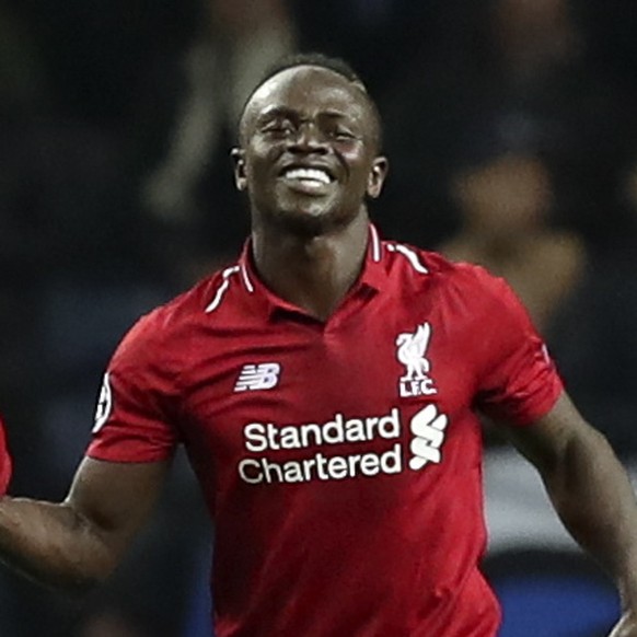 epa07512849 Liverpool's Sadio Mane (R) celebrates after scoring a goal against FC Porto during their UEFA Champions League quarter final, second leg, soccer match between FC Porto and Liverpool F ...