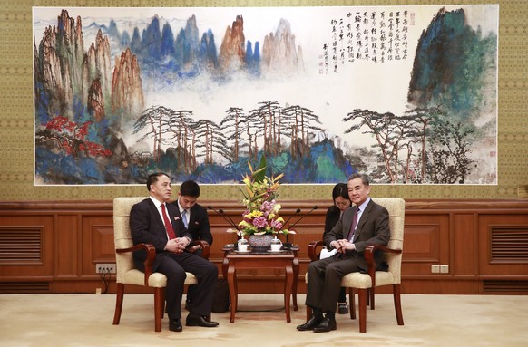 epa07403352 North Korean Vice Foreign Minister Ri Kil Song (L) speaks with Chinese Foreign Minister Wang Yi (R) during their meeting at the Diaoyutai State Guesthouse in Beijing, China, 28 February 20 ...