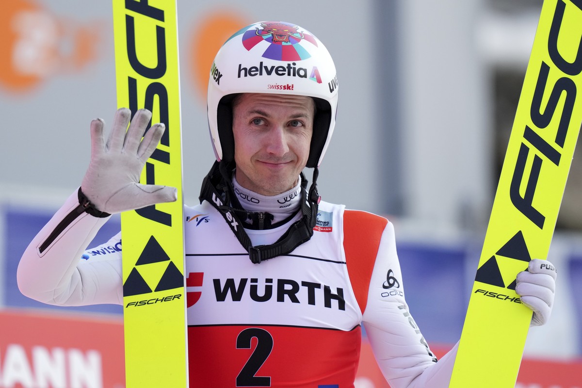 Switzerland's Simon Ammann reacts after landing during first round of the FIS Ski Flying World Cup in Oberstdorf, Germany, Sunday, March 20, 2022. (AP Photo/Matthias Schrader)