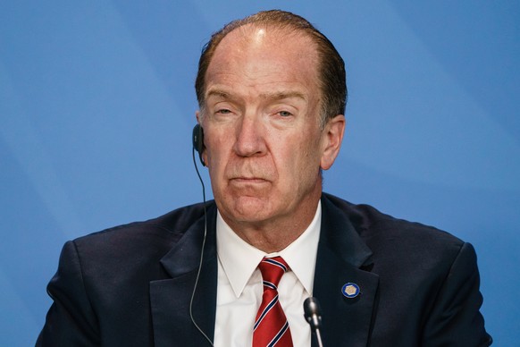 epa09431021 President of the World Bank David Malpass looks on during a press conference on the occasion of a meeting with economic and financial organizations in Berlin at the German chancellery in B ...