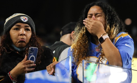 epa09645960 Fans react as Los Angeles Chargers tight end Donald Parham is carried out on a stretcher after an injury during the first half of the NFL American football game between the Kansas City Chi ...