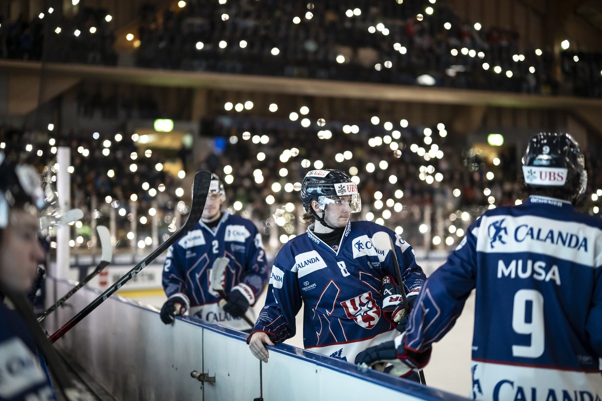 The US Collegiate Selects look on during a lightshow at the semifinals game between US Collegiate Selects and HC Sparta Praha of Czech Republic at the 97th Spengler Cup ice hockey tournament in Davos, ...