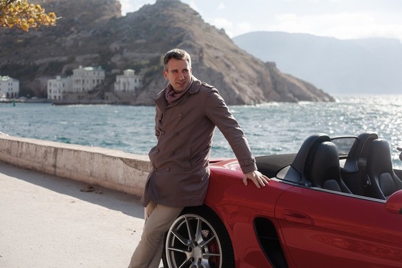 man with sports car