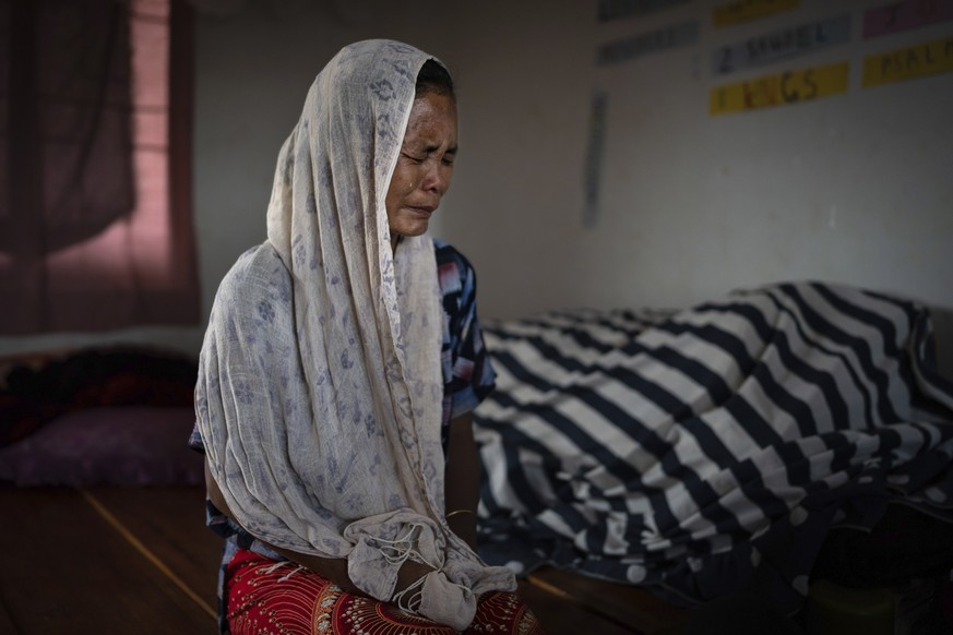 Kim Neineng, 43, a tribal Kuki, cries as she narrates the killing of her husband, at a relief camp in Churachandpur, in the northeastern Indian state of Manipur, Tuesday, June 20, 2023. Neineng escape ...