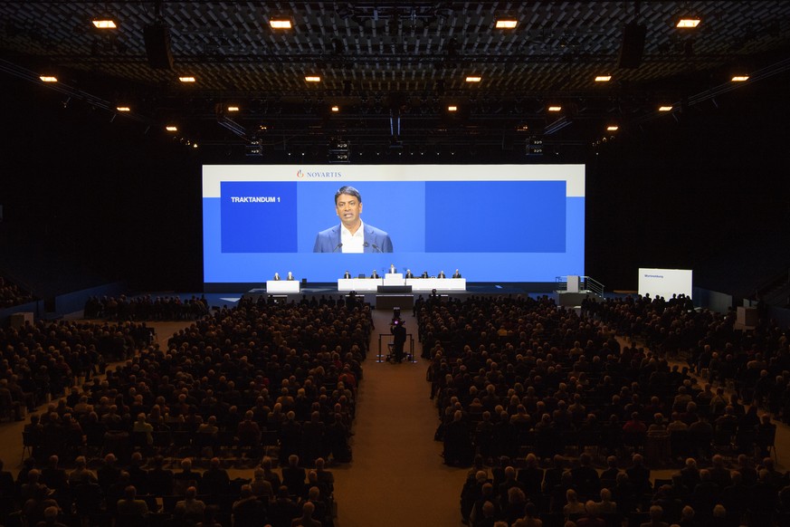 Vas Narasimhan, CEO Novartis, seen on the screen during the general assembly of Swiss Pharma group Novartis, at the St. Jakobshalle in Basel, Switzerland, this Friday, March 2, 2018. (KEYSTONE/Anthony ...