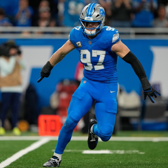 Detroit Lions defensive end Aidan Hutchinson (97) celebrates after sacking Minnesota Vikings quarterback J.J. McCarthy (9) during the second half of an NFL football game Sunday, Nov. 2, 2025, in Detro ...
