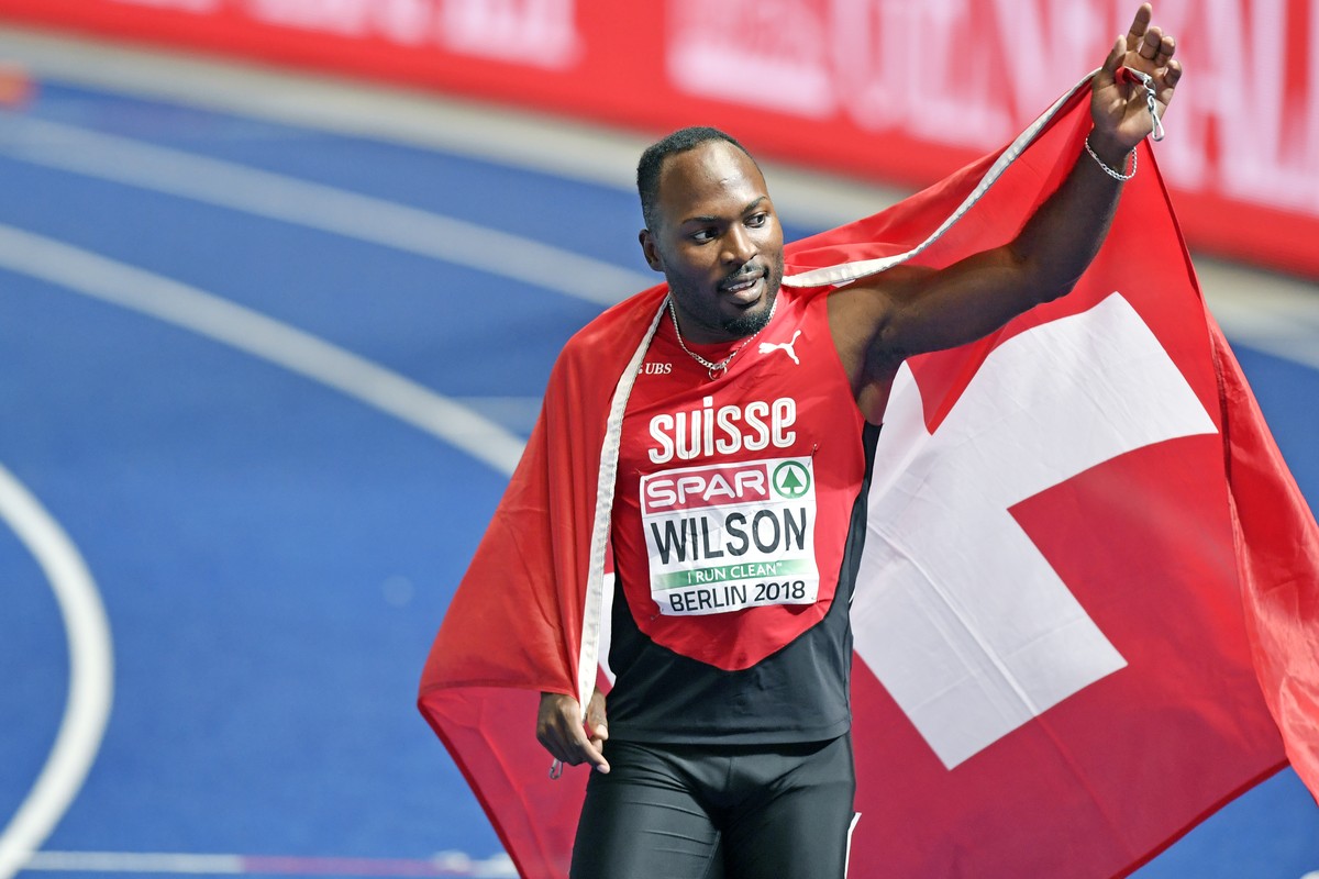Switzerland's Alex Wilson celebrates after win the bronze medal in the men's 200m final at the 2018 European Athletics Championships in the Olympiastadion stadium in Berlin, Germany, Thursda ...
