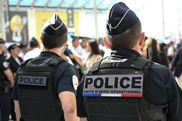 epa12184903 French police officers stand guard during a visit by the French interior minister at the Gare du Nord railway station, as part of a two-day operation for checks in stations, trains and bus ...
