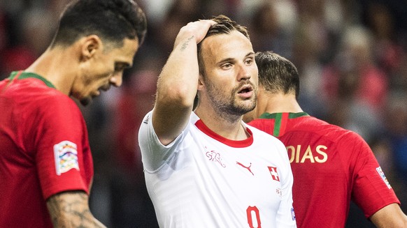 epa07628567 Switzerland&#039;s forward Haris Seferovic (C) reacts during the UEFA Nations League semi final soccer match between Portugal and Switzerland at the Dragao stadium in Porto, Portugal, 05 J ...