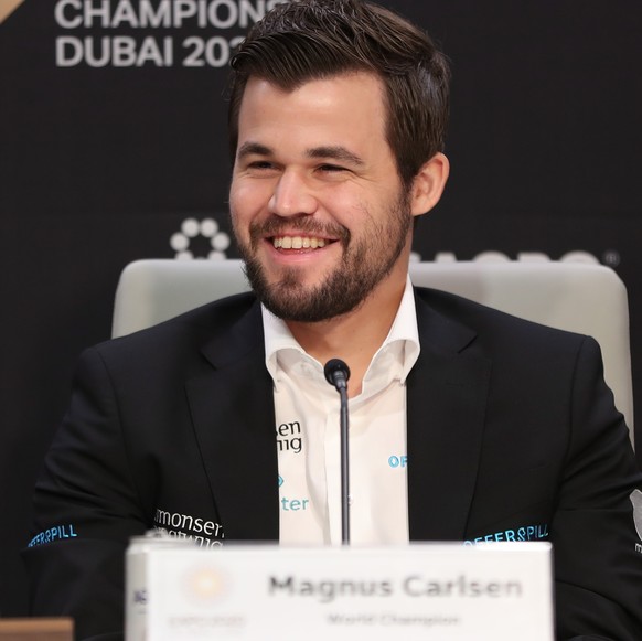 epa09600272 Magnus Carlsen of Norway attends a press conference prior to the FIDE World Chess Championship during the EXPO 2020 Dubai in Dubai, United Arab Emirates, 24 November 2021. 192 countries ta ...