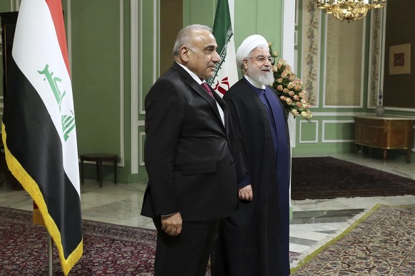 In this photo released by official website of the Office of the Iranian Presidency, Iraqi Prime Minister Adel Abdel Mahdi, left, and Iranian President Hassan Rouhani, meet at the Saadabad Palace in Te ...