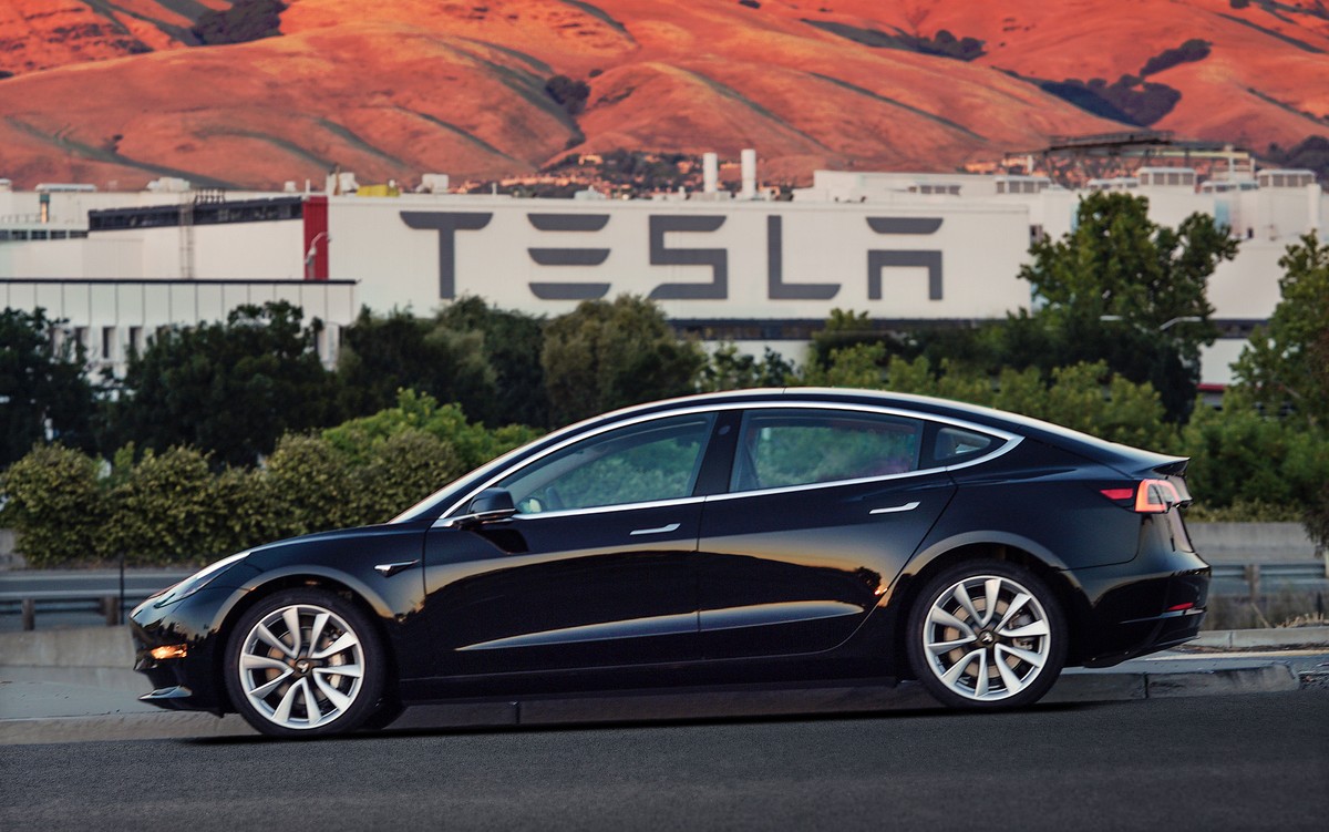 This undated image provided by Tesla Motors shows the Tesla Model 3 sedan. The electric car company’s newest vehicle, the Model 3, which set to go to its first 30 customers Friday, July 28, 2017, is h ...