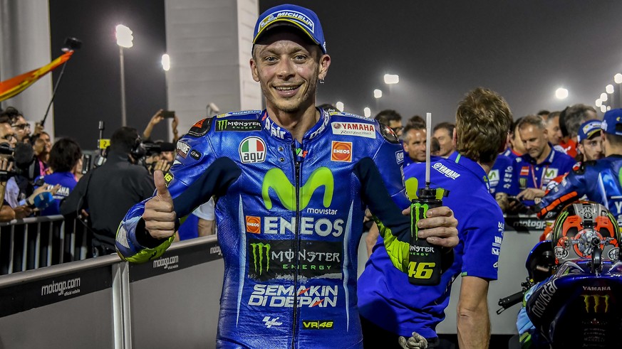 Italian MotoGP rider Valentino Rossi of the Movistar Yamaha MotoGP team celebrates during the MotoGP World Championship race at the Losail International Circuit in Doha, Qatar, Sunday, March 26, 2017. ...