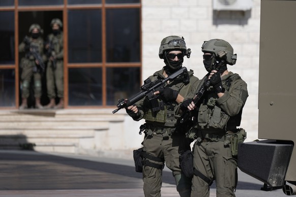 Israeli soldiers search the West Bank village of Qafin for the suspected gunmen who shot and killed an Israeli civilian at the entrance to a Jewish settlement in Hermesh on Tuesday, May 30, 2023.  ( ...
