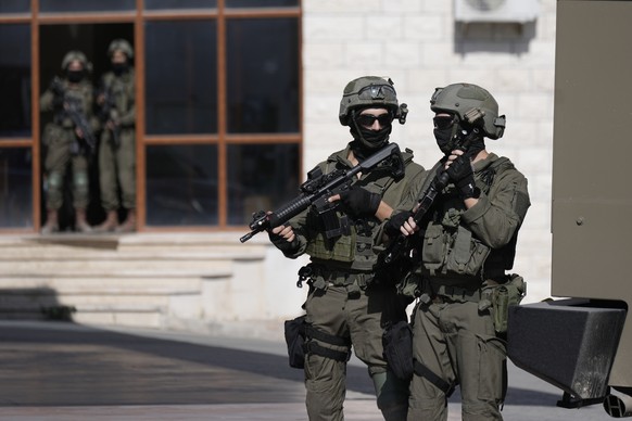 Israeli soldiers search in the West Bank village of Qafin for the suspected gunmen who shot and killed an Israeli civilian near the entrance to a Jewish settlement of Hermesh, Tuesday, May 30, 2023. ( ...