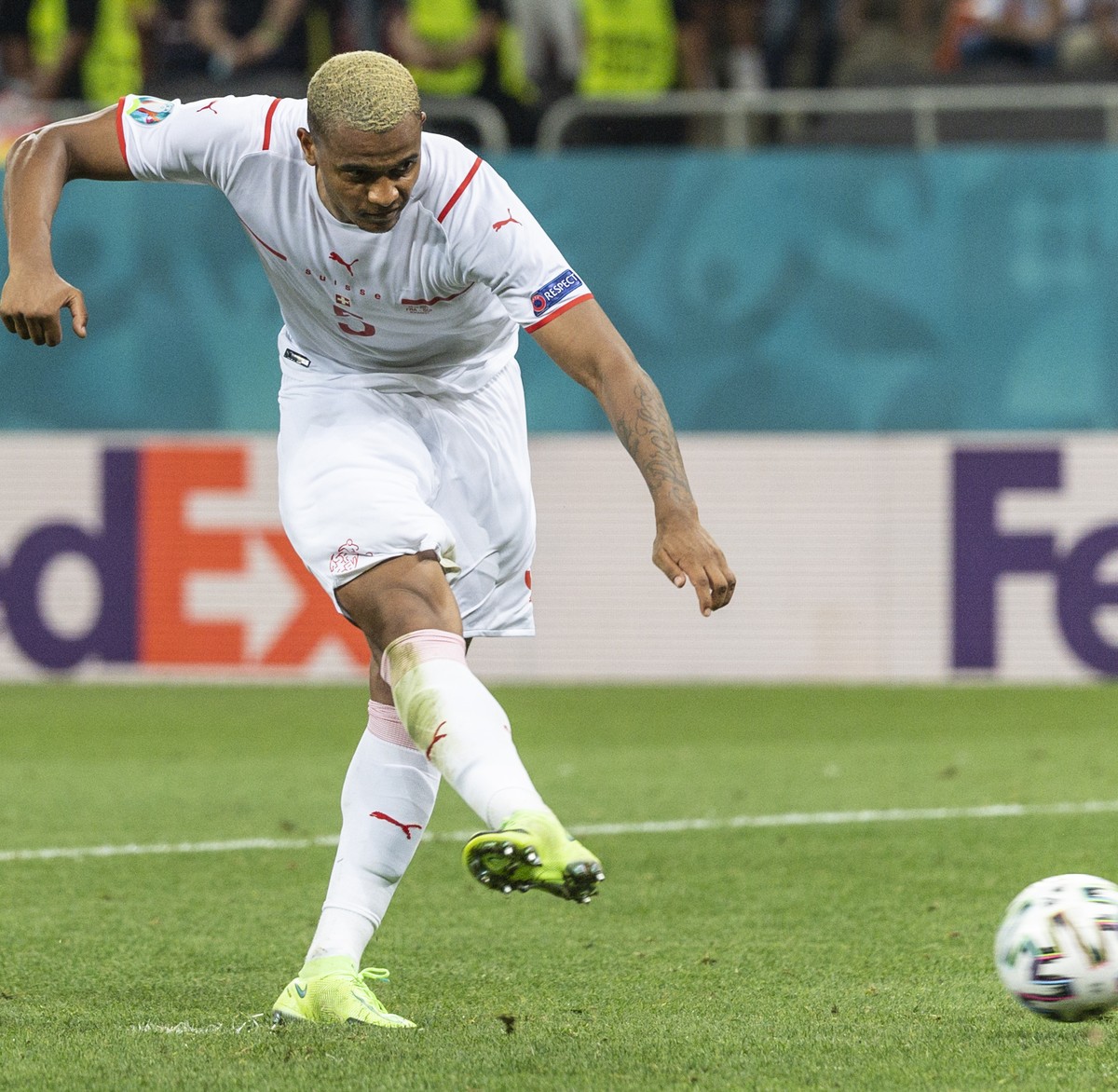Switzerland's defender Manuel Akanji shoots his penalty during the Euro 2020 soccer tournament round of 16 match between France and Switzerland at the National Arena stadium, in Bucharest, Romani ...