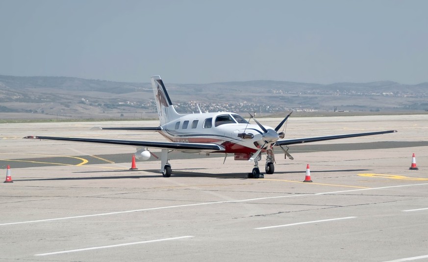 Burgas airport, Bulgaria - Sept 6, 2015: A single-engine piston turboprop-powered light aircraft Piper PA-46 500TP Malibu P46T of Piper Aircraft on the apron of the sunny airport. Travel concept