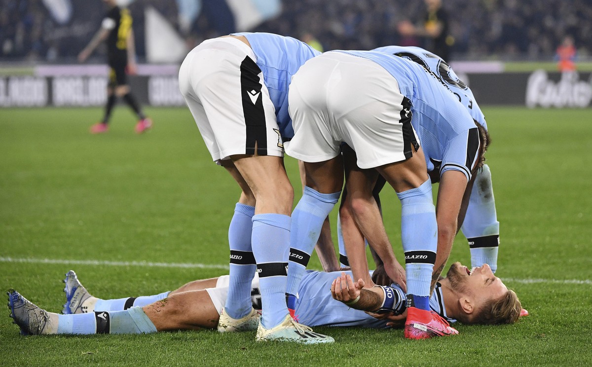 Lazio's Ciro Immobile, on the ground, celebrates with his teammates after he scored his side's first goal during the Serie A soccer match between Lazio and inter Milan, at Rome's Olympi ...