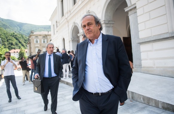The former president of the the European Football Association (Uefa), Michel Platini, center, is leaving the Swiss Federal Criminal Court in Bellinzona, Switzerland, after the first day of his trial,  ...