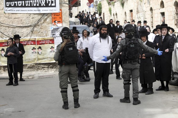 Ultra Orthodox Jews gather during a protest against government&#039;s measures to stop the spread of the coronavirus in the orthodox neighborhood of Mea Shearim in Jerusalem, Monday, March 30, 2020. ( ...