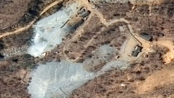 This April 20, 2018, satellite image provided by DigitalGlobe shows the nuclear test site in Punggye-ri, North Korea. Foreign journalists will journey into the mountains of North Korea this week to ob ...