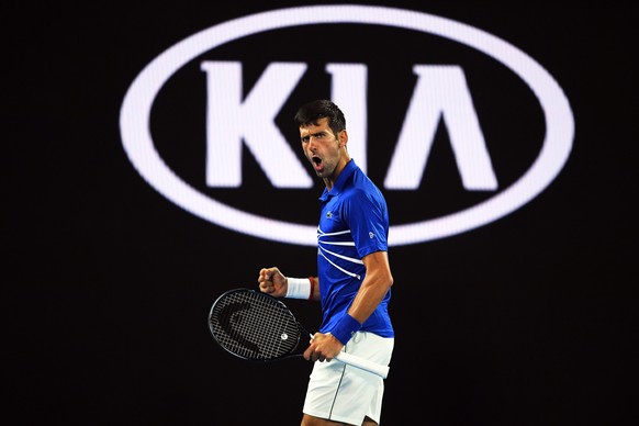 epa07317854 Novak Djokovic of Serbia reacts during his men&#039;s singles semi final match against Lucas Pouille of France at the Australian Open Grand Slam tennis tournament in Melbourne, Australia,  ...