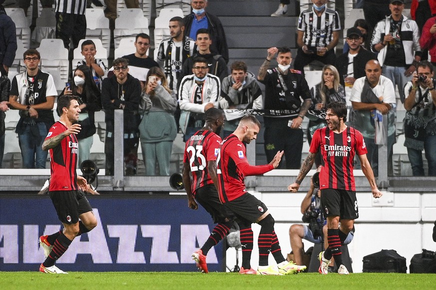 AC Milan&#039;s Ante Rebic celebrates after scoring his side&#039;s first goal during the Serie A soccer match between Juventus and AC Milan, at the Turin Allianz stadium, Italy, Sunday, Sept. 19, 202 ...