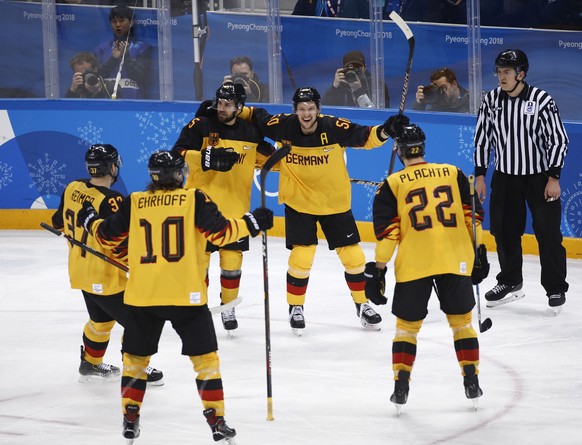 Patrick Hager (50), of Germany, celebrates with his teammates after scoring a goal during the second period of the semifinal round of the men&#039;s hockey game at the 2018 Winter Olympics in Gangneun ...