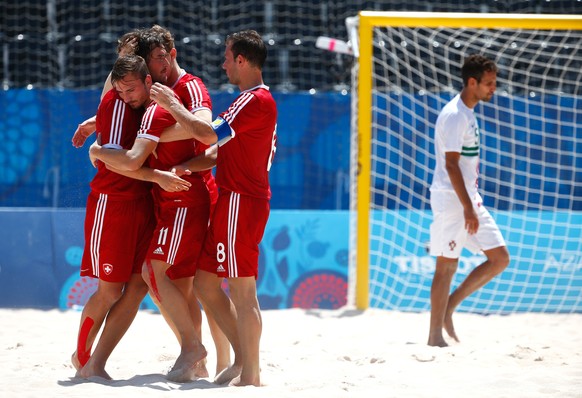 BAKU, AZERBAIJAN - JUNE 28: Noel Ott (11) and Moritz Jaeggy (8) of Switzerland celebrates with team mates during the Men&#039;s Beach Soccer bronze medal match between Switzerland and Portugal on day  ...