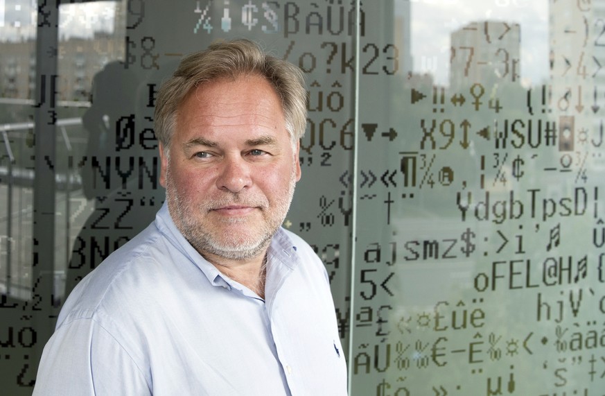 FILE - In this July 1, 2017, file photo, Eugene Kaspersky, the Russian antivirus programs developer and chief executive of Russia&#039;s Kaspersky Lab, stands in front of a window decorated with progr ...