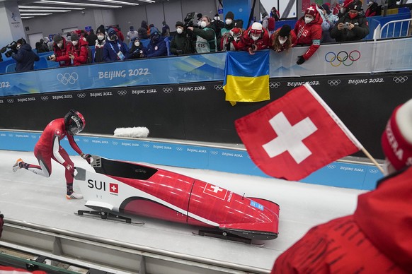 Melanie Hasler, of Switzerland, drives her bobsled during women&#039;s monobob heat 1 at the 2022 Winter Olympics, Sunday, Feb. 13, 2022, in the Yanqing district of Beijing. (AP Photo/Pavel Golovkin)