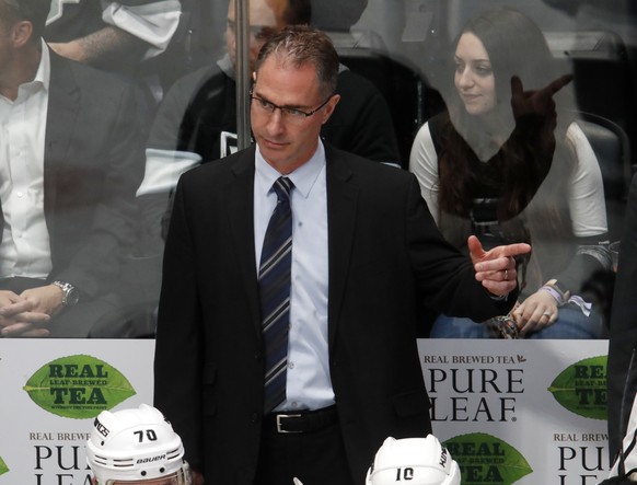 FILE - In this March 22, 2018, filer photo, Los Angeles Kings coach John Stevens gestures to his team during the third period against the Colorado Avalanche in an NHL hockey game in Denver. Stevens ha ...