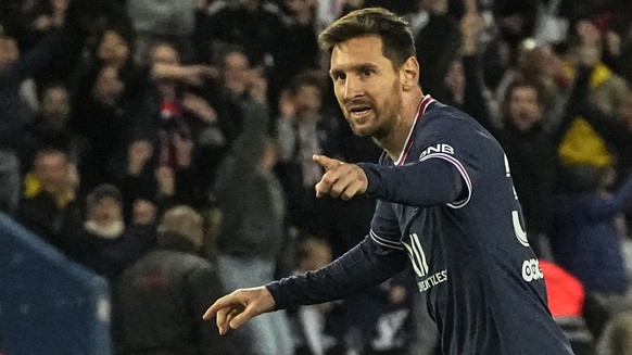 PSG's Lionel Messi celebrates after scoring the opening goal during the French League One soccer match between Paris Saint Germain and Lens at Parc des Princes stadium in Paris, Saturday, April 23, 2022. (AP Photo/Michel Euler)