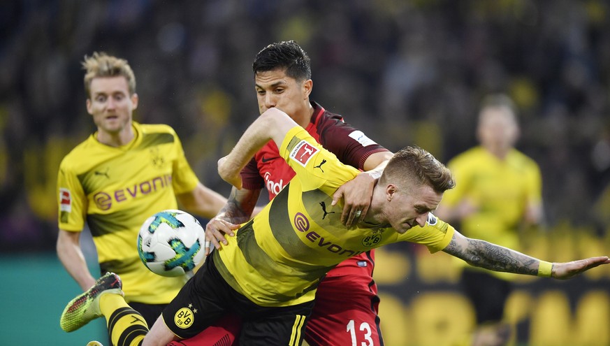 Dortmund&#039;s Marco Reus, in front, and Frankfurt&#039;s Carlos Salcedo challenge for the ball during the German Bundesliga soccer match between Borussia Dortmund and Eintracht Frankfurt in Dortmund ...