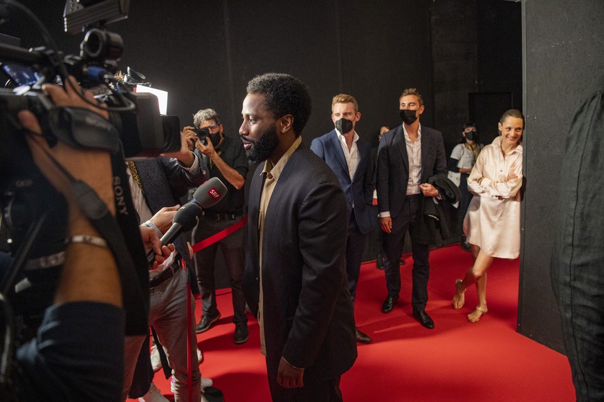 Actor John David Washington from USA of the Film, Beckett, on the red carpet at the Palaexpo Hall on the 74th Locarno International Film Festival in Locarno, Switzerland, Wednesday, August 4, 2021. Th ...