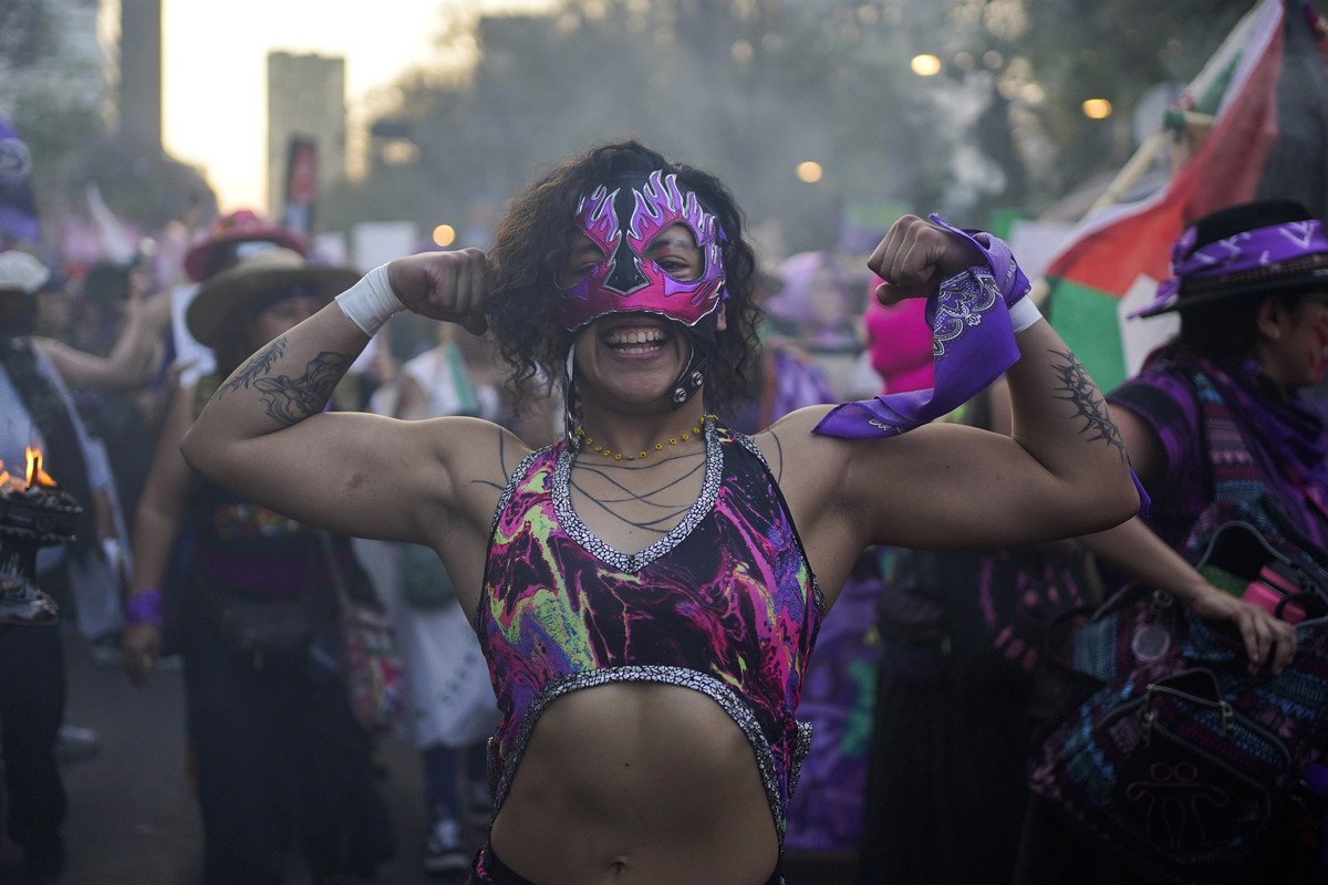 A demonstrator strikes a pose during a march against gender-based violence marking International Women's Day, in Mexico City, Friday, March 8, 2024. (AP Photo/Aurea del Rosario)