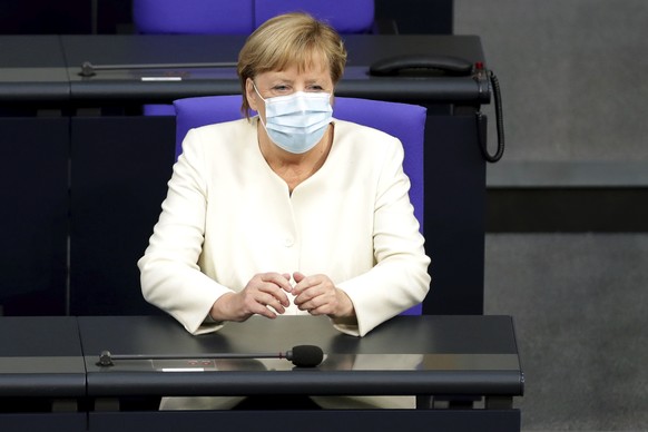 German Chancellor Angela Merkel arrives for a budget debate as part of a meeting of the German federal parliament, Bundestag, at the Reichstag building in Berlin, Germany, Tuesday, Sept. 29, 2020. (AP ...