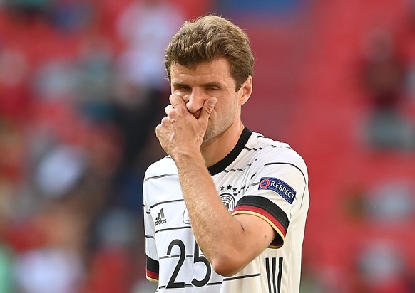 epa09286084 Thomas Mueller of Germany reacts during the UEFA EURO 2020 group F preliminary round soccer match between Portugal and Germany in Munich, Germany, 19 June 2021. EPA/Christof Stache / POOL  ...