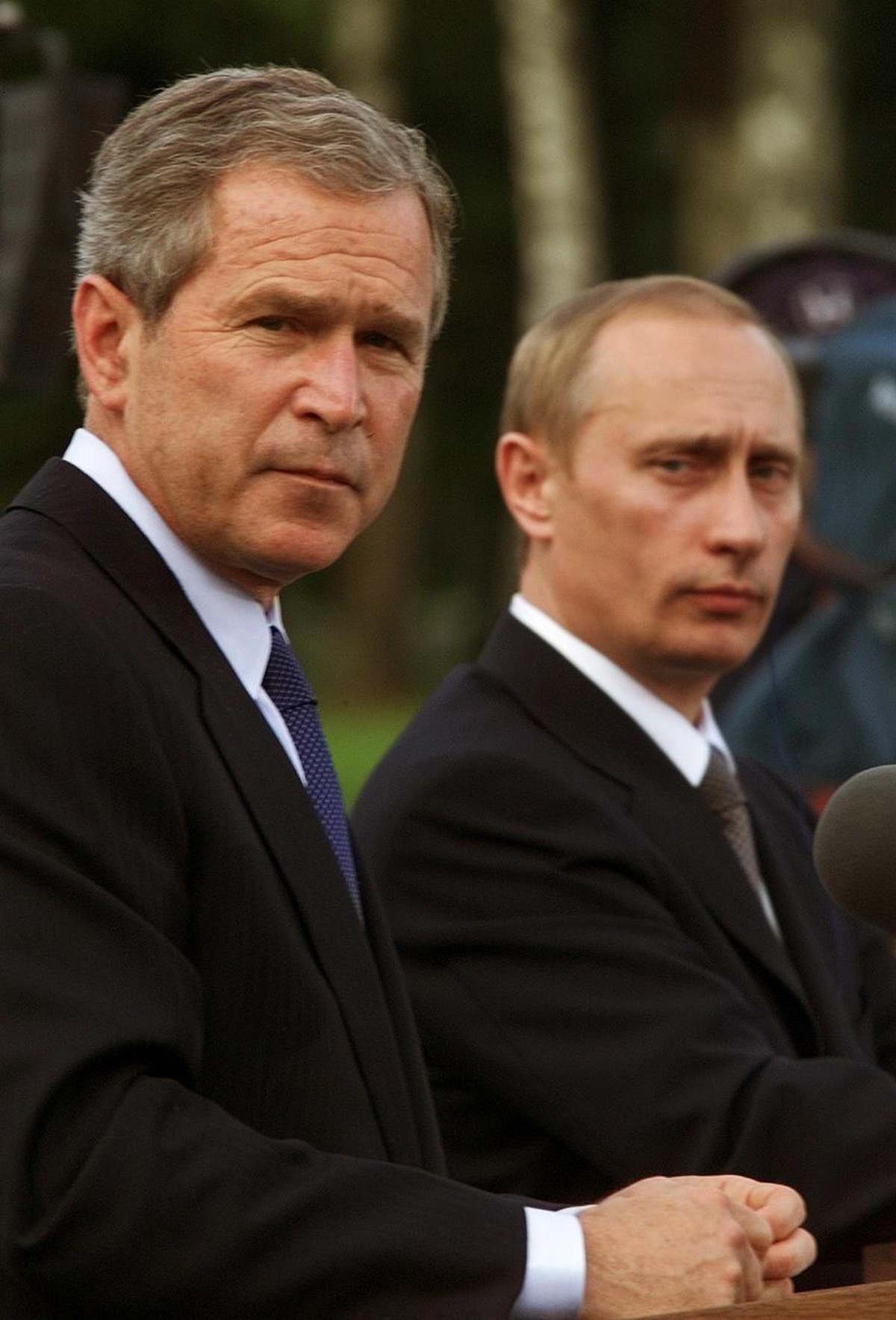 President Bush, left, and Russia's President Vladimir Putin, right, take part in a joint news conference after meeting for the first time, Saturday, June 16, 2001, in Ljubljana, Slovenia. After m ...