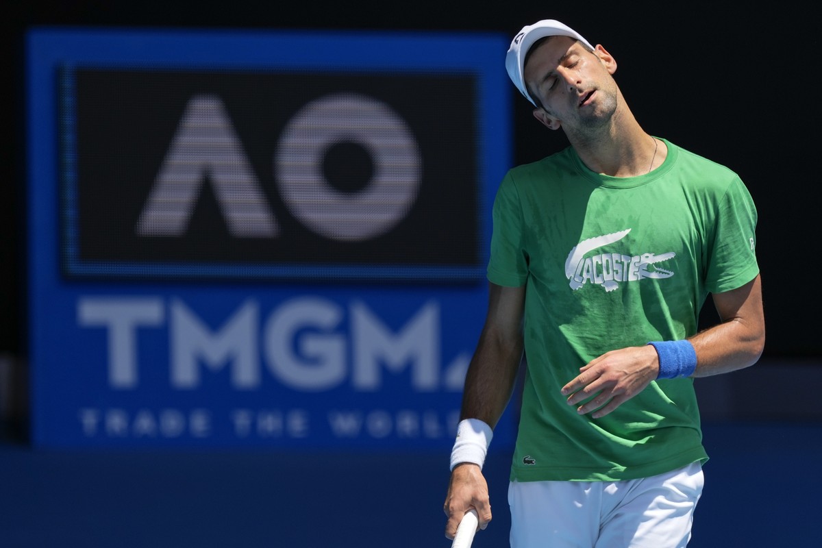 Defending men's champion Serbia's Novak Djokovic practices on Margaret Court Arena ahead of the Australian Open tennis championship in Melbourne, Australia, Thursday, Jan. 13, 2022. AP Photo ...